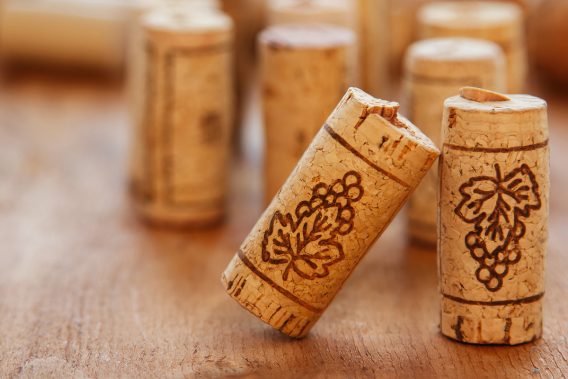 Different corks on wooden surface